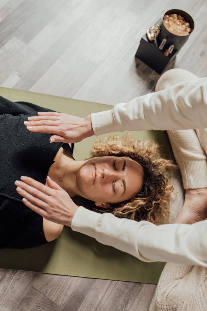 Woman Lying on the Floor Having Therapy