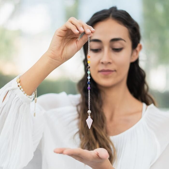 Woman Healing her Chakras with Healing Stones